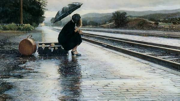 雨の中電車をまつ少女